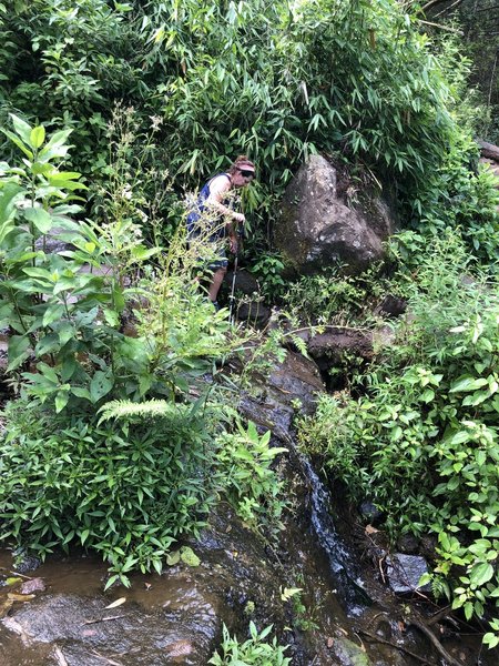 Crossing the top of a small waterfall