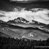 View of Longs Peak, highest point in Rocky Mountain National Park, elevation 14,255 feet. Fifteenth highest Colorado 14er. July 12, 2019 and still snow capped above 12,000 feet.