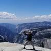 At the peak of Clouds Rest with the "Inverse Tunnel View" of the Yosemite Valley in the background. he out-and-back hike to Clouds Rest from Tenaya Lake is one of the most rewarding one in Yosemite.