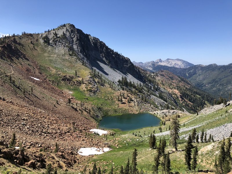 On top of Deer Creek pass, overlooking the first of the four lakes and Siligo peak. The trail continues up to the left of the photo.