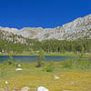 Lowest Pioneer Basin Lake and its surrounding meadow. The largest of the campsites here is often used by people whose gear is brought in by pack mules.