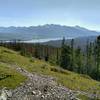 The broad Athabasca River in the distance, below mountains of the Jaques Range is seen to the south-southeast from Devona Lookout.