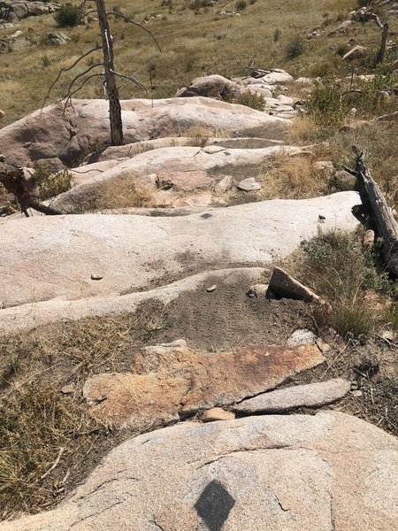 Steep downhill section over boulders