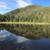 Lake Arnold with wooded false summit of Colden