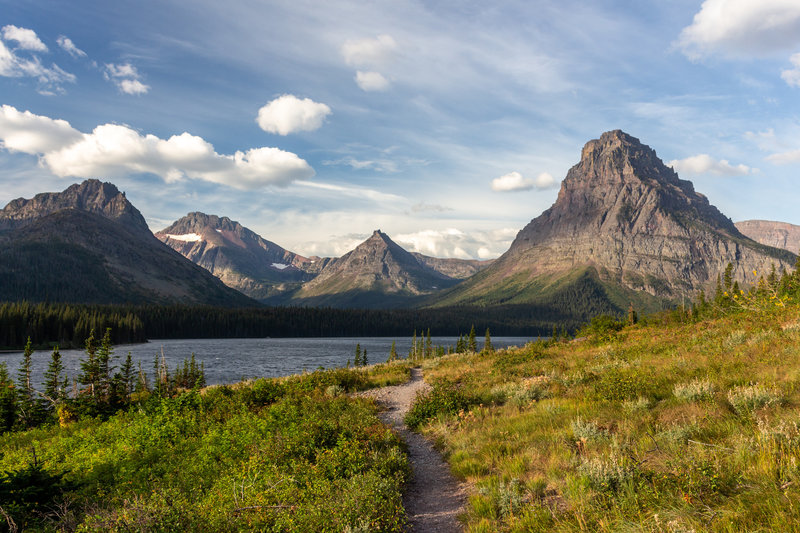 Never Laughs Mountain, Grizzly Mountain, Painted Tepee Peak, and Sinopah Mountain (left to right) with Two Medicine Lake in the front