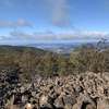 Views of the ocean and the city of Hobart while crossing the Potato Fields.