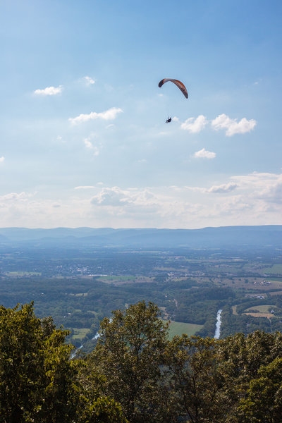 a hang glider seen from the nearby Woodstock Tower