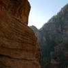 Standing behind the knife edge of the pinnacle looking out one side of it.