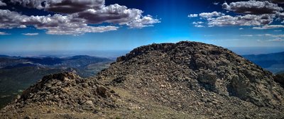 14,120' elevation from the top of the western Twin Sisters Peak, looking east towards the other Twin. Wonder what they're taking pics of? Idea of scale from here, looking down the saddle up.