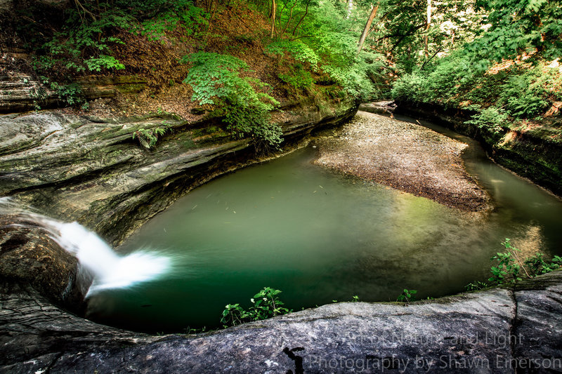 Pool of water opposite the tall waterfall at La Salle Canyon