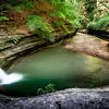 Pool of water opposite the tall waterfall at La Salle Canyon