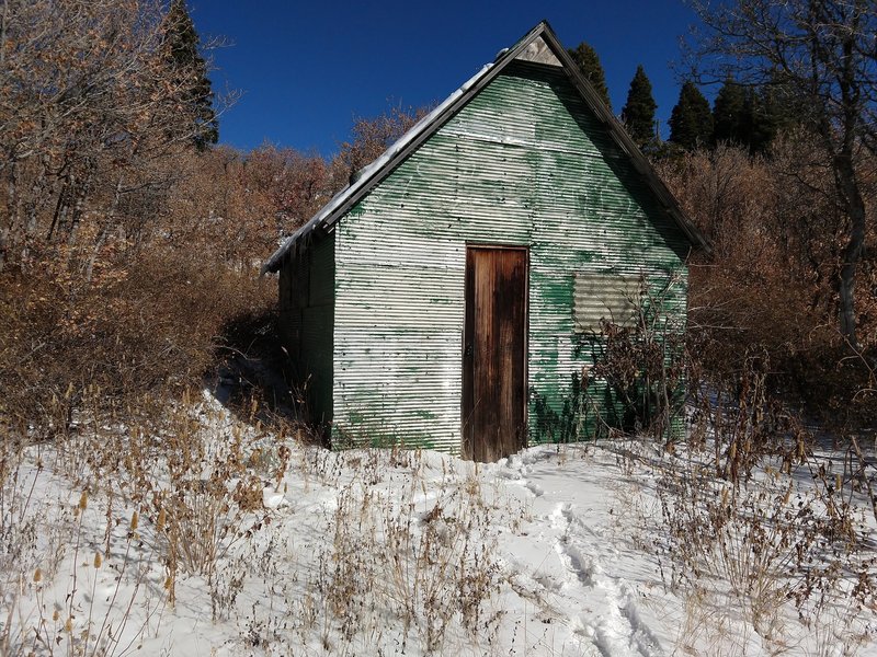 Well-stocked cabin along trail at mid-mountain