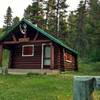 Waterfalls Warden Cabin. About a century old, this very well preserved warden cabin and out buildings is found along Pobokatan Pass Trail. Overlooking Poboktan Creek, it has a great view of Waterfalls Peak from its front porch.