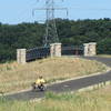 Recumbent Trike At Bridge Over Maynard" by John Eisenschenk (https://tinyurl.com/u4emtb8), Flickr licensed under CC BY 2.0 (https://creativecommons.org/licenses/by/2.0/).