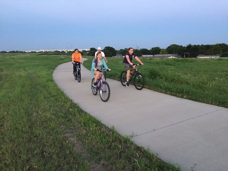 A family on the trail at dusk