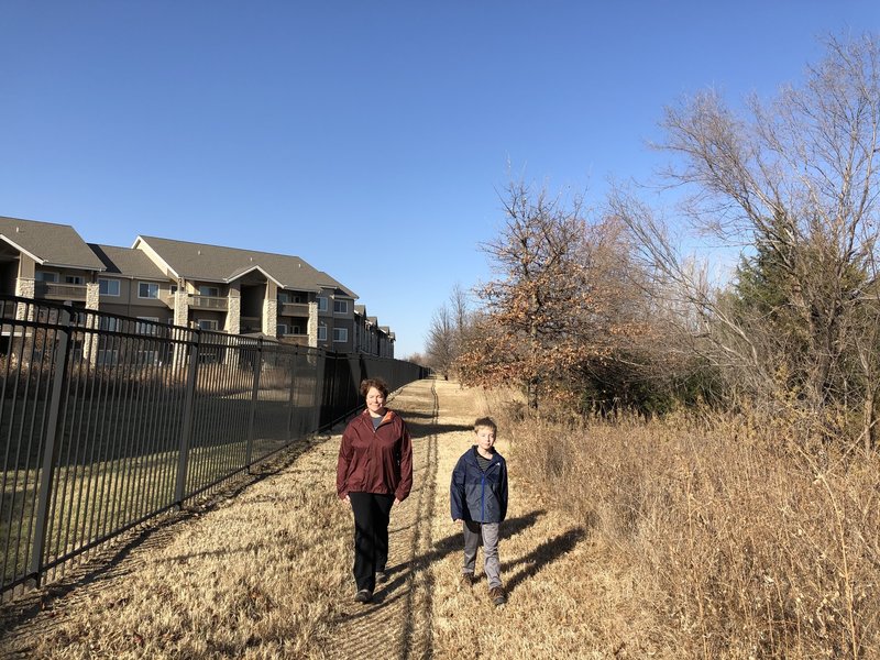 The apartment complex has access to the trails through a locked gate.