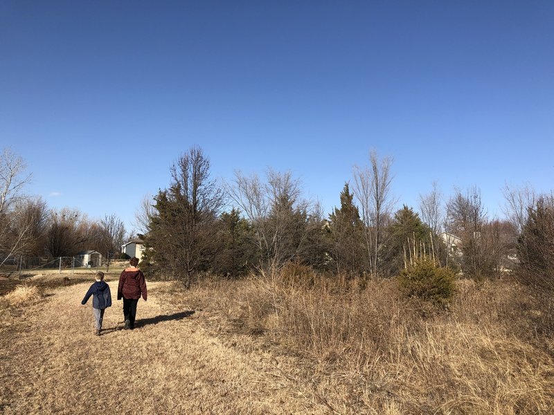 The trail merges at a drainage pipe crossing and there are several options to walk from here.