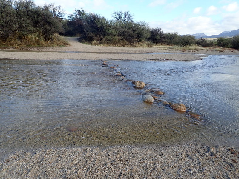 The rocks make it appear as if you can safely cross on them. Don't be fooled, your feet are gonna get wet!