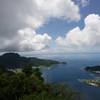Pago Pago Harbor sits below the summit of Mount Alava.  You can see where the coral reefs are in the bay below.