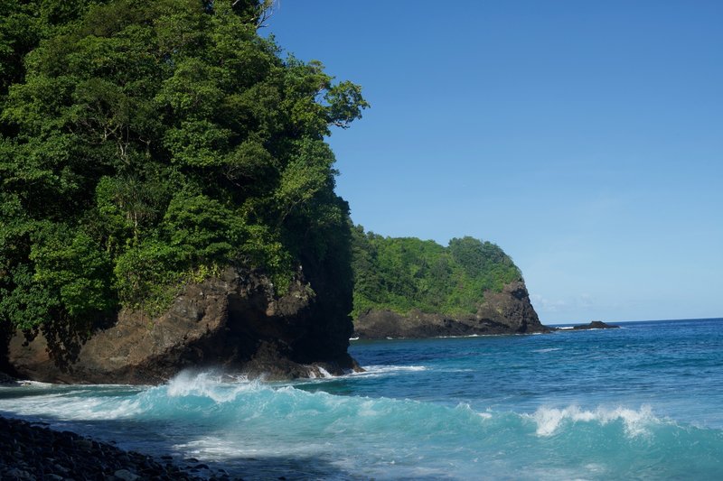 Waves crash into the shore as you emerge from the forest onto the rocky beach. The surf and currents are strong, so listen to the park services recommendation not to swim in this area.