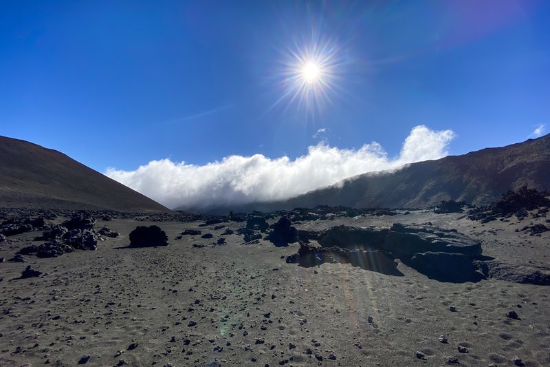 Sand, clouds, and sun make for a unique view.