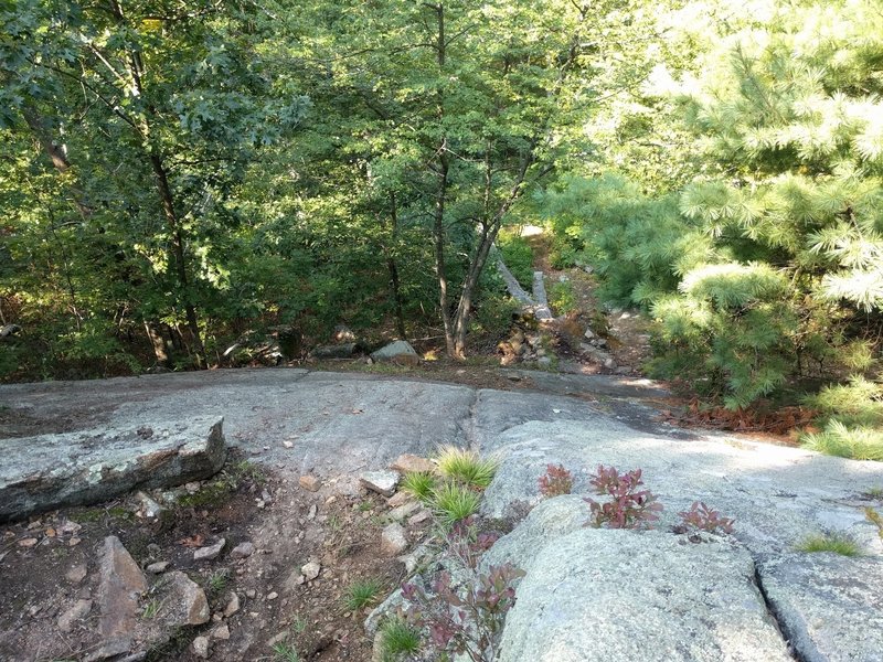 Long, steep rock slab.