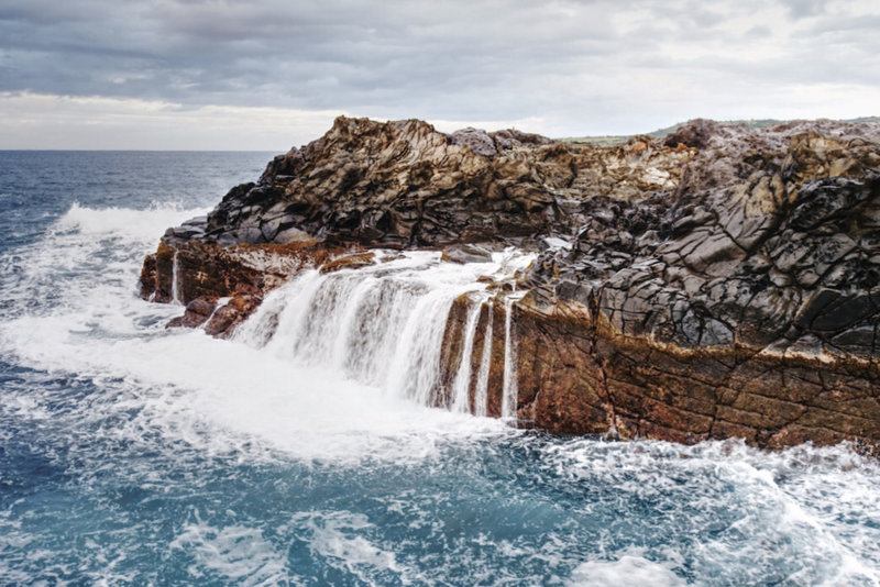 A temporary waterfall after the waves crashed over the rocks at the end of the peninsula.