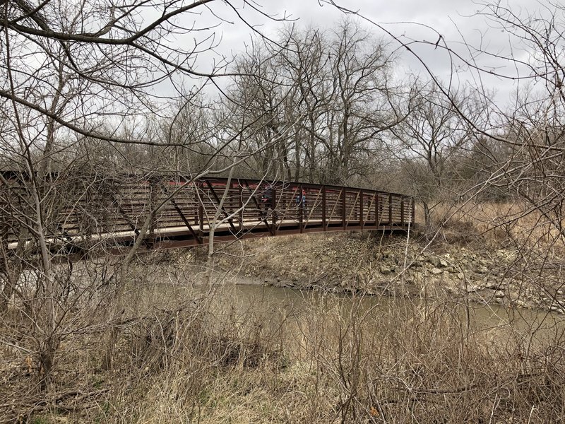 the South-most metal bridge crossing the Cowskin creek in the park