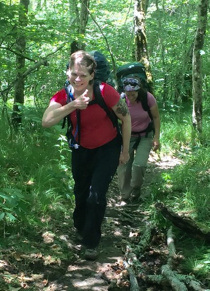 Hikers give a "thumbs up" for the work of volunteers improving the trail