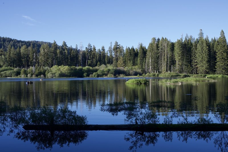 As you hike along the shore, you can watch as people fish in the lake.