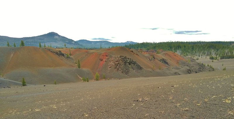 Painted Dunes on the southeast side of Cinder Cone, seen from Nobles Emigrant Trail (East). In the distance to the southeast is Mt. Hoffman, 7,833 ft.