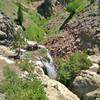 At the top of Mill Creek Falls, the tallest waterfall in Lassen Volcanic Nationals Park, East Sulphur Creek plunges off a cliff to drop over 70 feet into its creek valley far below.