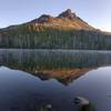 Duffy Butte reflected in the lake.