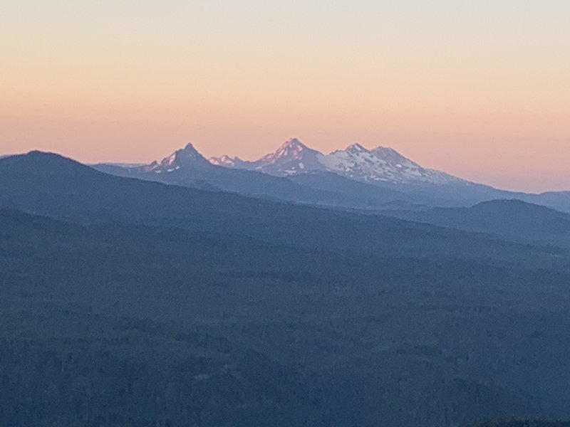 The three sisters from sunrise on Bachelor Mountain.