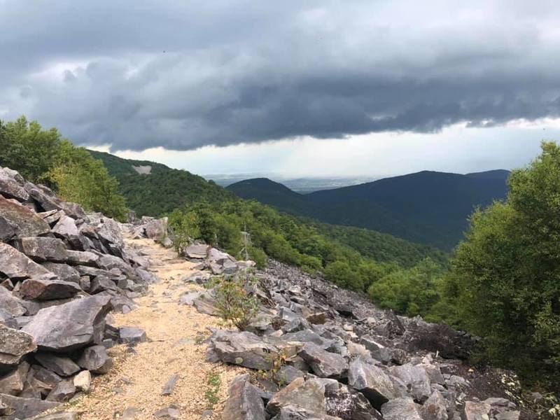 Trail curving around talus slope at Blackrock Mountain summit area.