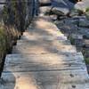 Stairs to the steppingstones in the run.