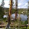 Tiny Edmond Lake is set in a rocky, thinly wooded area along Highline Trail.