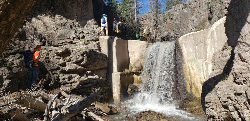 The old Guaje Reservoir in Guaje Canyon right near where North Mitchell Trail intersects the Guaje Canyon trail. Note the handline on the ledges to the left of the dam. This allows secure passage up and around the dam.