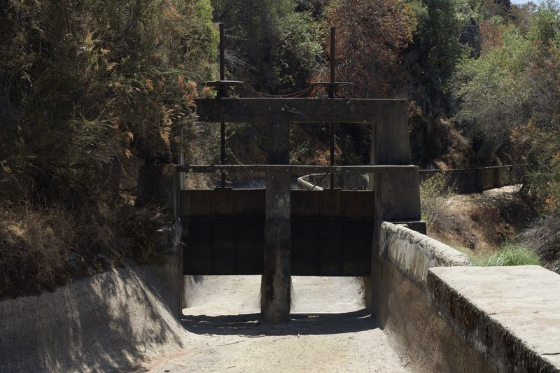 Old sluice gates sit at the end of the trail.