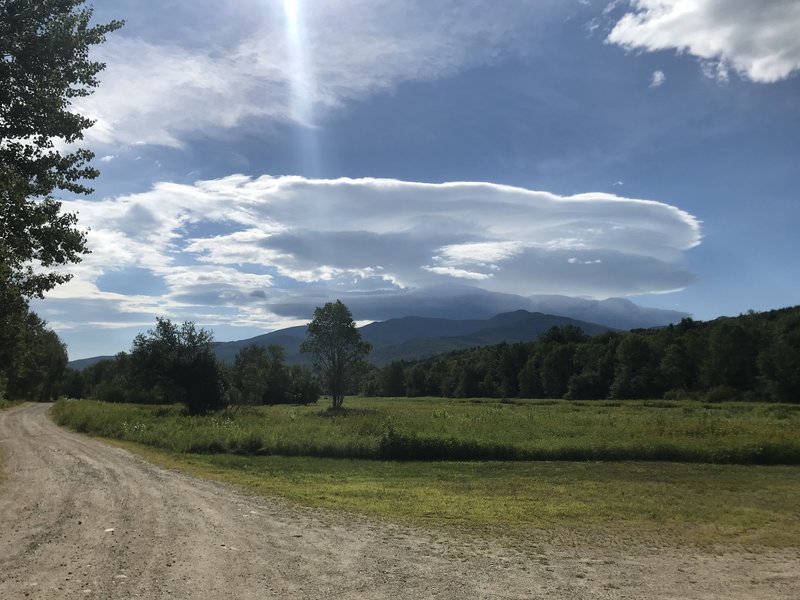 Cascading clouds over the mountain peaks.