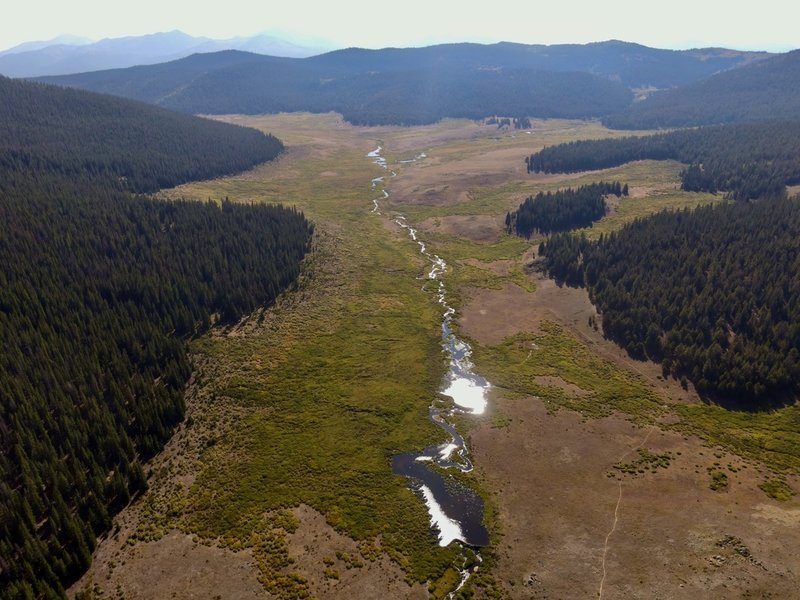 Drone footage - sun on the water looking north up the valley about 7 miles in (counter-clockwise).  Trail in the lower right.