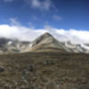 Panorama of clouds rolling over the ridge.