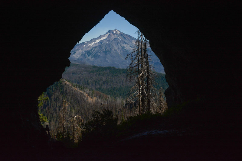Boca Cave's entrance perfectly frames Mount Jefferson.