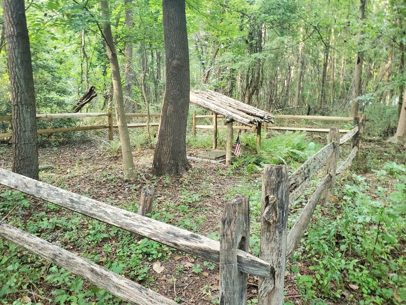 A very old grave, with a relatively new shelter.