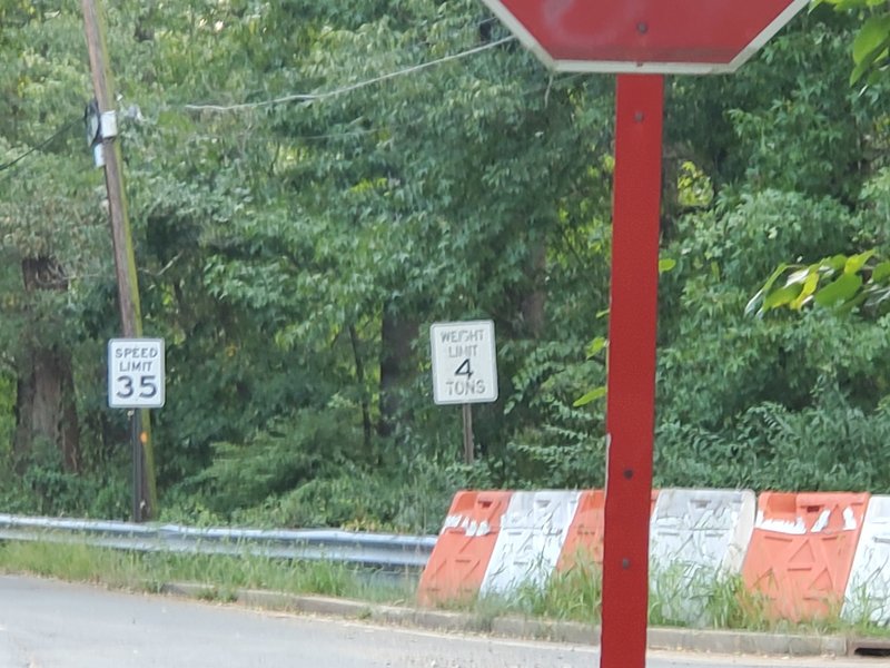 The tiny orange trail blaze under the speed limit signifies where you should go when spit out onto Davidson Mill Rd.