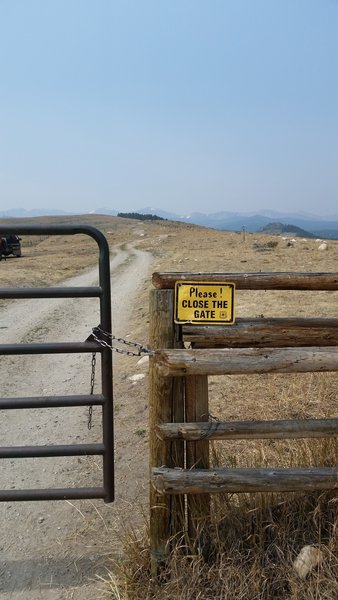 Livestock gate. Lake Angeline Cirque barely visible on horizon.