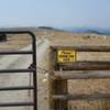 Livestock gate. Lake Angeline Cirque barely visible on horizon.