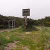 Tall wooden sign marks the center of the Bayocean Townsite.