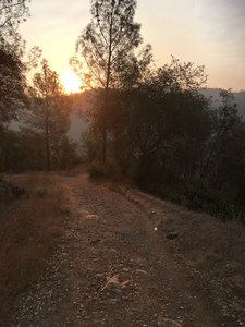Sun peeking up over the mountain tops.