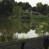 The Oxley Nature Center Interpretive Center across BJs Pond from the outlook on the Meadowlark Prairie Trail.